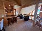 The Loft has Comfortable Seating and TV